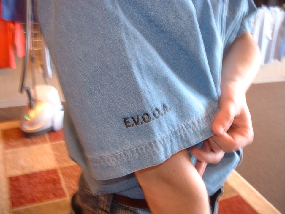 Light blue t-shirt with E.V.O.O.A. text