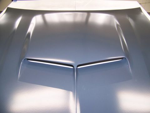 1972 Ford Ranchero - Close-up of a car hood, showing a prominent central scoop with vents.