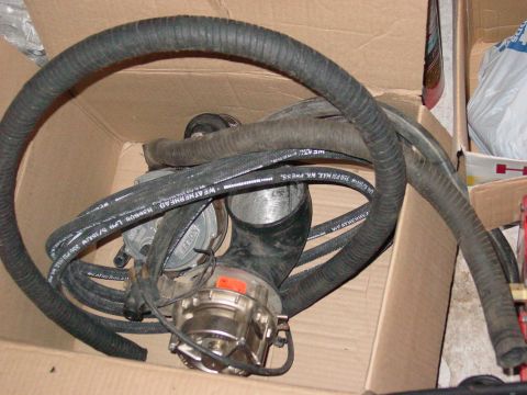 1979 Ford Bronco - A propane regulator and hoses are shown inside a cardboard box.