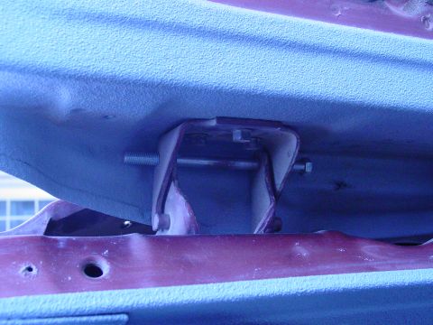 1979 Ford Bronco - Close-up view of a door hinge bracket, likely from a vehicle's interior or body panel.