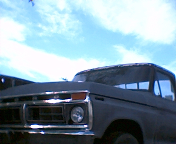 1977 Ford F-150 - Front view of a 1977 Ford F-150, highlighting its distinctive grille and headlight design.