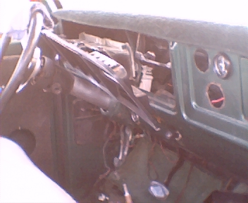 1977 Ford F-150 - Interior view of a 1977 Ford F-150 dashboard, showing the steering column and gauge cluster area.