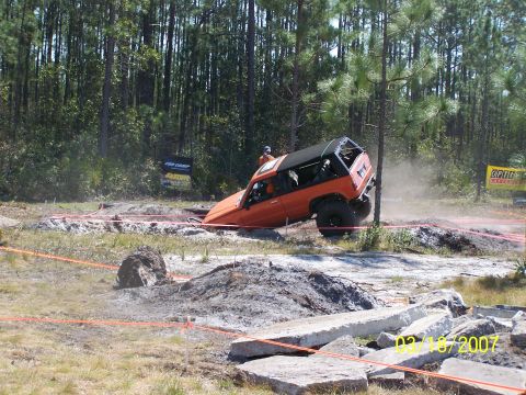 1989 Ford Bronco - Off-road SUV stuck in a challenging dirt obstacle course during an event on 02/18/2007.