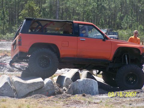 1989 Ford Bronco - An orange SUV navigates a rocky obstacle course on March 18, 2007.