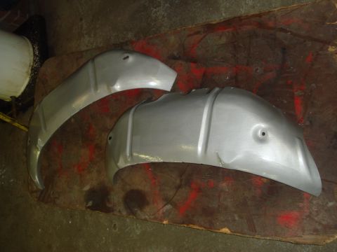 1996 Ford Bronco - Two metal inner fender liners are shown, possibly for a vehicle restoration project.