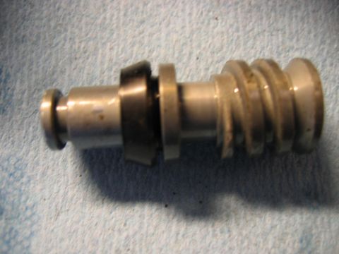 1985 Ford LTD Crown Victoria - A close-up view of a metal component with threaded sections and a rubber seal.