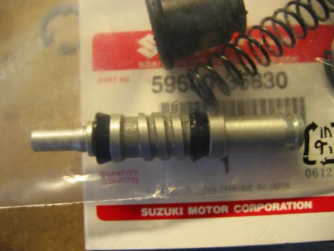 1985 Ford LTD Crown Victoria - Close-up of a Suzuki brake master cylinder part, showing part number 596-5830.