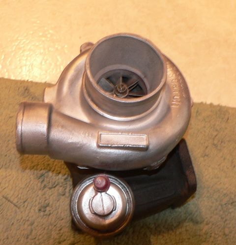 1996 Ford Probe - Turbocharger and wastegate actuator shown on a textured surface.