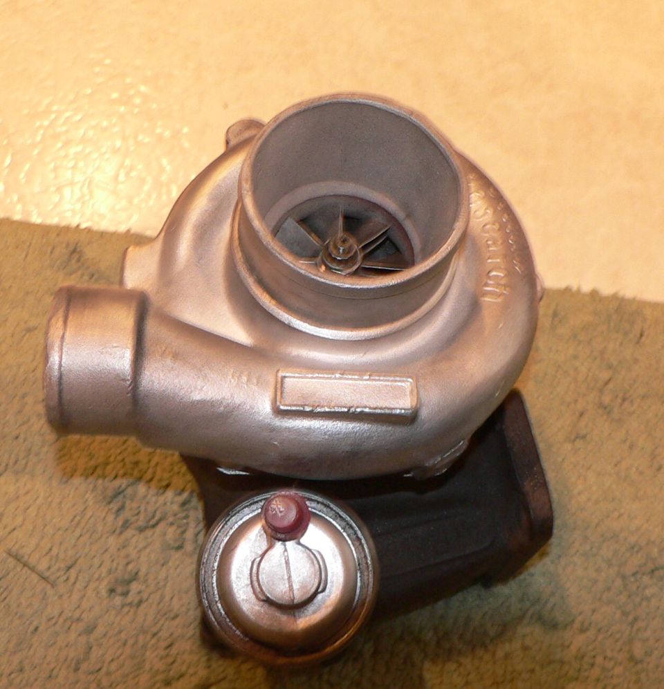 Turbocharger with wastegate actuator. Part number area is blank