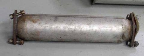 1996 Ford Probe - This is an exhaust component with visible mounting hardware. The registry claims it is from a 1996 Ford Probe GT, but this is unconfirmed.