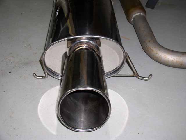 Exhaust muffler with chrome tip and bent pipe section