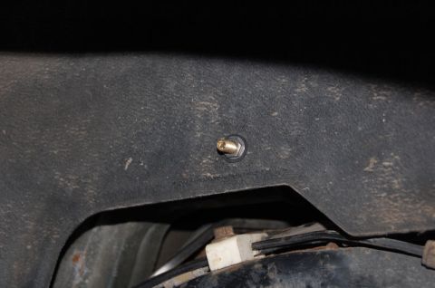 1985 Mercury Grand Marquis - Air valve stem installed on vehicle frame, likely for an air suspension system.