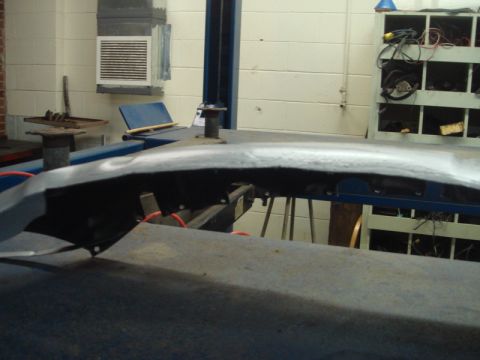 1996 Ford Bronco - A car body panel is shown on a lift, with visible signs of repair and modification.