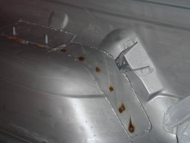Inner fender with metal patch and rust spots
