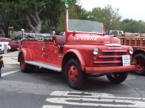 1990 Ford Bronco - This vintage Dodge fire truck has 'LA VERNE' painted on its hood and a license plate reading 6J9477.