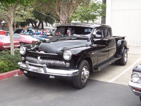 1990 Ford Bronco - This black Mercury pickup truck with dual rear wheels was seen at a car show.