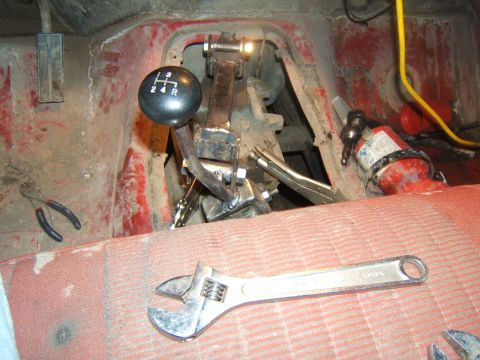 1980 Ford F-250 - Tools and a manual transmission shifter are visible inside a vehicle's cabin.