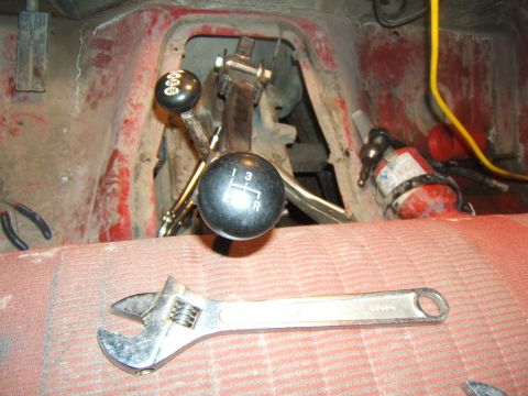 1980 Ford F-250 - Adjustable wrench rests on the seat next to the manual transmission and 4x4 transfer case shifters.