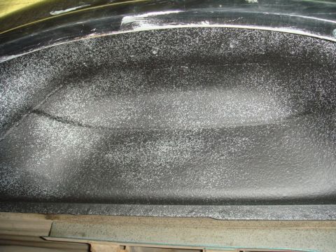 1996 Ford Bronco - The textured coating on this inner fender well is visible, showing a rough, speckled finish.