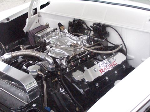 1990 Ford Bronco - The engine bay features a polished intake manifold and Ford Racing valve covers.