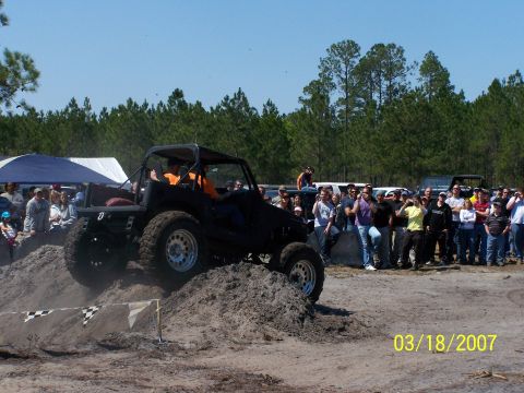 1989 Ford Bronco - A crowd watches an off-road vehicle navigate a dirt obstacle during an event on March 18, 2007.