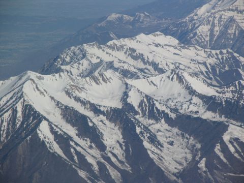 1995 Ford C-350 (Centurion Conversions) - Aerial view of , snow-covered mountain ranges stretching into the distance.