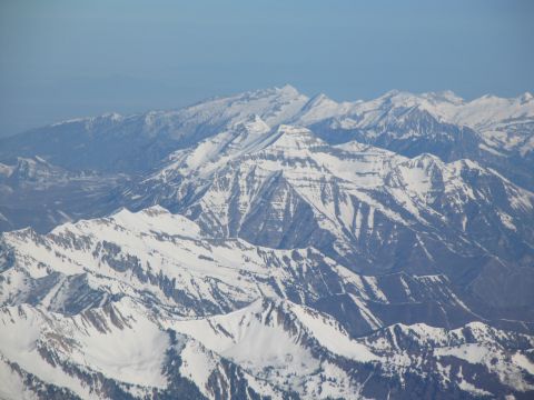 1995 Ford C-350 (Centurion Conversions) - Expansive view of snow-capped mountains, likely taken from an airplane.
