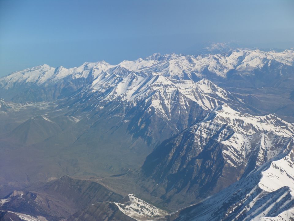 Snow-capped mountains under a clear blue sky