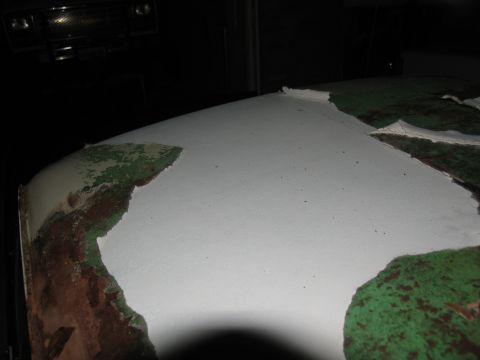1995 Ford C-350 (Centurion Conversions) - Vehicle roof paint is peeling, showing multiple layers underneath. A grille is visible in the background.
