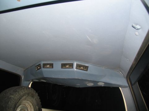 1995 Ford C-350 (Centurion Conversions) - Custom console with multiple air vents installed in the vehicle's interior ceiling.