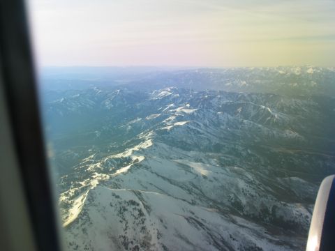 1995 Ford C-350 (Centurion Conversions) - Aerial view of snow-capped mountains, taken from an aircraft.