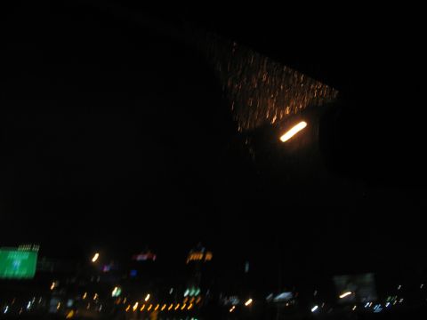 1995 Ford C-350 (Centurion Conversions) - Driving at night through a city with rain on the windshield.