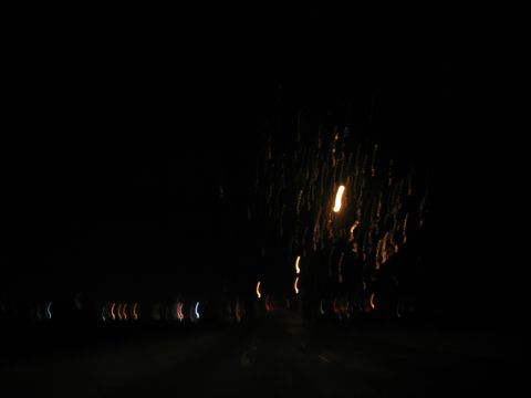 1995 Ford C-350 (Centurion Conversions) - Abstract night scene with colorful light streaks, suggesting motion or distant illumination.