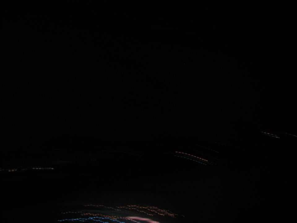 Streaking lights at night, possibly from a moving vehicle