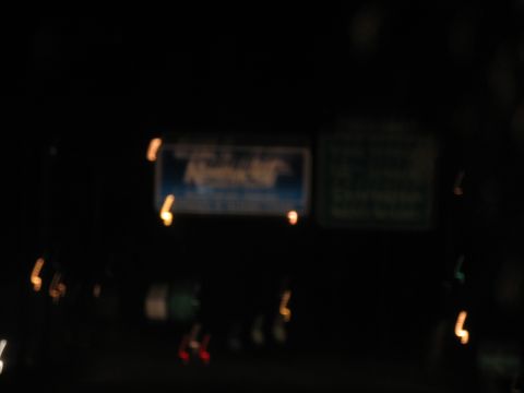 1995 Ford C-350 (Centurion Conversions) - Nighttime view of illuminated road signs and passing vehicle lights.