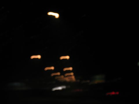 1995 Ford C-350 (Centurion Conversions) - Abstract streaks of light suggest movement at night.
