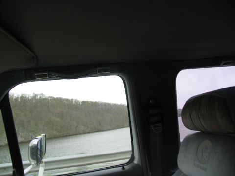 1995 Ford C-350 (Centurion Conversions) - Looking out the window from the passenger seat of a vehicle.