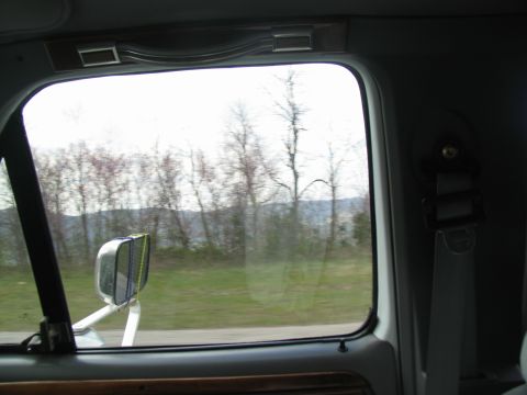 1995 Ford C-350 (Centurion Conversions) - Looking out the window of a vehicle at the passing scenery.