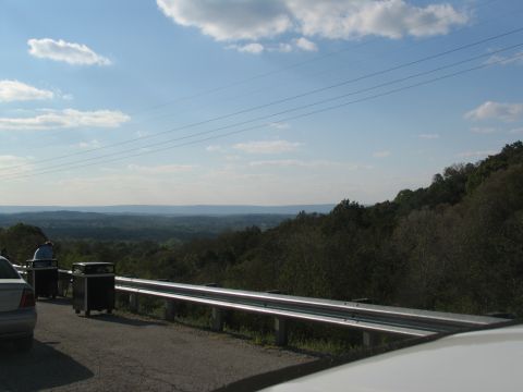 1995 Ford C-350 (Centurion Conversions) - A scenic view from a roadside overlook on a partly cloudy day.