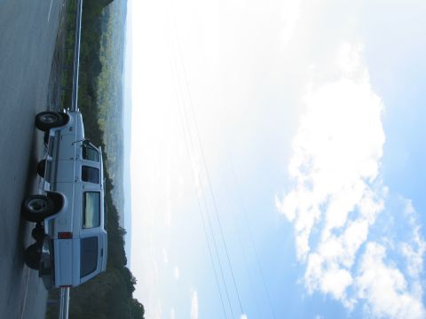 1995 Ford C-350 (Centurion Conversions) - This 1995 Ford C-350 Centurion Conversions van is seen parked on the side of the road with a scenic vista in the background.