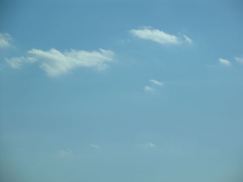 1995 Ford C-350 (Centurion Conversions) - A clear blue sky with wispy clouds drifting by.