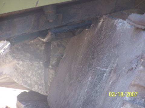 1989 Ford Bronco - The underside of a vehicle is shown with large rocks, captured on March 18, 2007.
