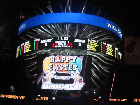 1991 Ford Bronco - A basketball scoreboard displays game information and a holiday greeting from the Miami Heat.