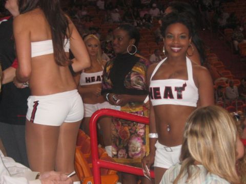 1991 Ford Bronco - Women in 'HEAT' branded outfits are seen at an event, possibly a sporting match.