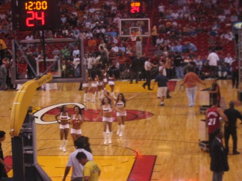 1991 Ford Bronco - A basketball game is in progress, with cheerleaders on the court and a scoreboard displaying the time and score.