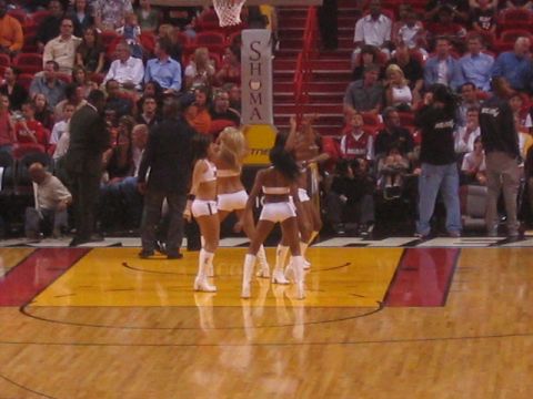 1991 Ford Bronco - Cheerleaders perform on the court during a basketball game.