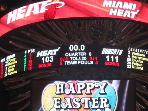 1991 Ford Bronco - Scoreboard displays the Miami Heat with 103 points against the Charlotte Bobcats with 111 points.