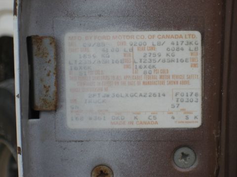 1986 Ford Bronco - Vehicle identification plate shows manufacturing date of September 1985.