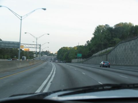 1995 Ford C-350 (Centurion Conversions) - View from a vehicle driving on a multi-lane highway with other cars and trucks.