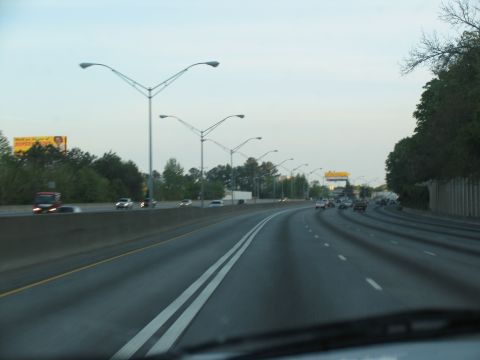 1995 Ford C-350 (Centurion Conversions) - A view from a vehicle on a highway with multiple lanes and other cars.